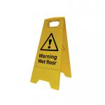 The photo shows a Spectrum Industrial Heavy Duty A Board with multiple Danger Signs and a bright yellow Wet Floor warning sign. The signs are mounted on a steel frame and the A Board sits on a tiled surface with caution tape in the background.