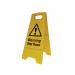 The photo shows a Spectrum Industrial Heavy Duty A Board with multiple Danger Signs and a bright yellow Wet Floor warning sign. The signs are mounted on a steel frame and the A Board sits on a tiled surface with caution tape in the background.