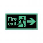 The photograph captures a set of fire safety signs with a Niteglo feature, including a running man symbol and an arrow pointing to the exit on the right. These self-adhesive signs measure 150x450mm and are designed to promote safety.