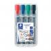 The photograph features a pack of four Staedtler Flipchart Markers in assorted colors. The markers are neatly lined up on a white background, with their caps off and tips facing forward. Each marker has a slim, cylindrical shape and a clip on the cap for easy carrying. The colors range from bright red and blue to deep green and black, providing a versatile selection for any flipchart or whiteboard.