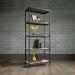 This picture features a stylish Teknik Bookcases Teknik Office Industrial Style Bookcase with a durable black metal frame and charter oak effect. The generously sized shelves provide ample storage for all your office essentials.