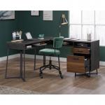 The photo showcases the stylish Teknik SoHo Furniture Teknik Office Canyon Lane L-Shaped Desk in a rich Brew Oak effect. The durable 1in thick desktop provides ample workspace, while the filing drawers add functionality. The 360 degree all round finish adds a touch of elegance to this desk.