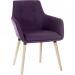 Two purple plum-colored reception chairs with a unique four-legged design from Teknik 6929, suitable for use in office waiting areas or meeting rooms. The sleek lines and curved backrest give a modern and professional appearance.