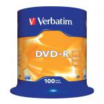 The photograph shows a stack of unprinted Verbatim DVDs in a spindle, each with a capacity of 4.7GB and a recording speed of 16x. There are 100 discs in the pack. The DVDs have a silver finish and are neatly stacked and ready for use.