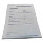 The photo shows a stack of Wallace Cameron Health and Safety Books, specifically the Accident Report Book model number 5401015 with the product code WAC10796. The books have a simple blue cover and feature organized sections for recording accidents.